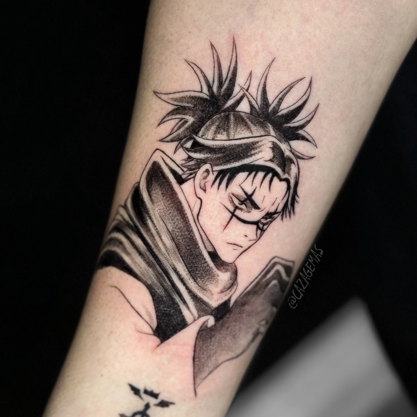 Black and grey anime tattoo of a character with tied-up hair