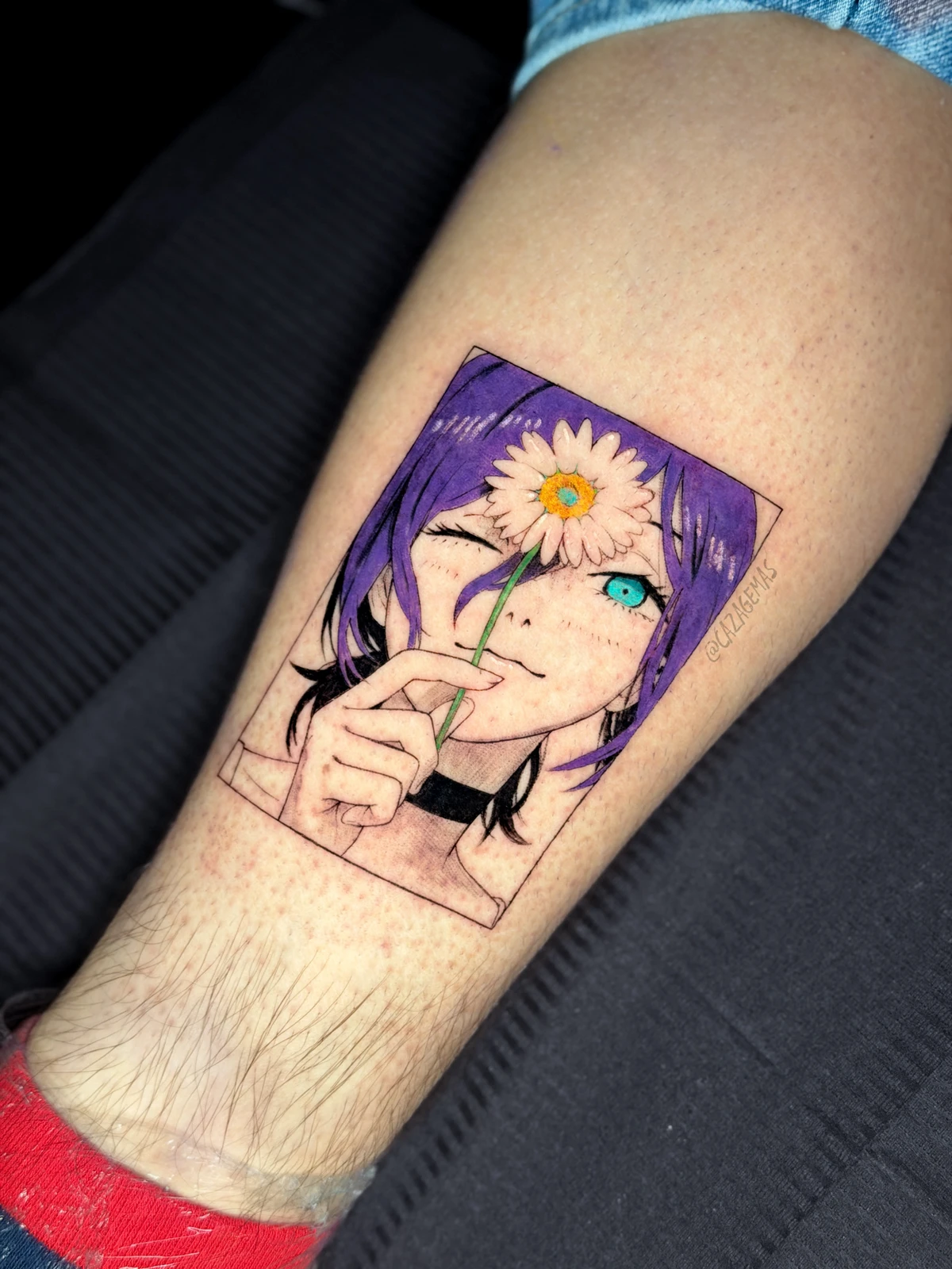 Color tattoo of a violet-haired anime character with a daisy